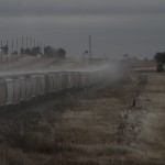 Snow blowing off the grain train as it gathers momentum