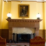 The lobby fireplace with a painting of Walter Deveraux, weathy banker that established the hotel.