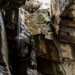 The snow was melting as it hit the granite and running into the cave.