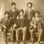 This image is known as the "Fort Worth Five Photograph."  Front row left to right: Harry A. Longabaugh, alias the Sundance Kid, Ben Kilpatrick, alias the Tall Texan, Robert Leroy Parker, alias Butch Cassidy; Standing: Will Carver & Harvey Logan, alias Kid Curry; Fort Worth, Texas, 1900. (courtesy Wikimedia Commons)